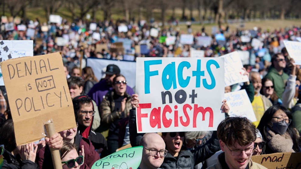 A protest with a sign that says "Facts not facism"